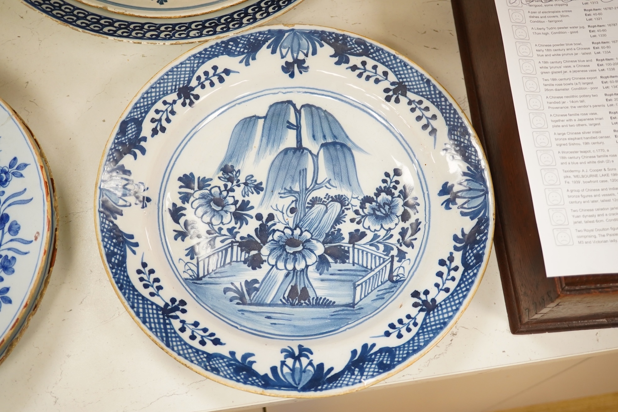 Five 18th century Delft dishes, largest 36.5cm diameter. Condition - poor to fair